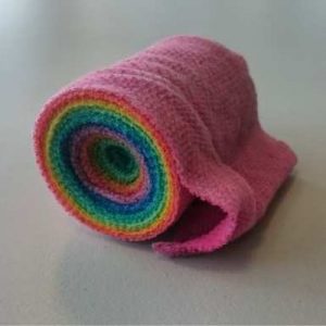 a rainbow coloured roll of bandages 